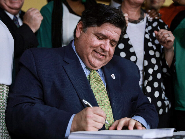 FILE - In this June 25, 2019, file photo, Gov. J. B. Pritzker signs a bill in Chicago. Pritzker's administration says it will put more than $3.7 billion into highway construction next year alone. The Democrat on Monday, Oct. 21, 2019 released the annual update to the state's transportation improvement …