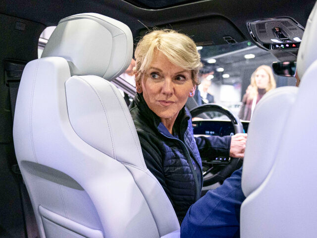 Energy Secretary Jennifer Granholm sits in a Cadillac Lyriq all electric vehicle during a