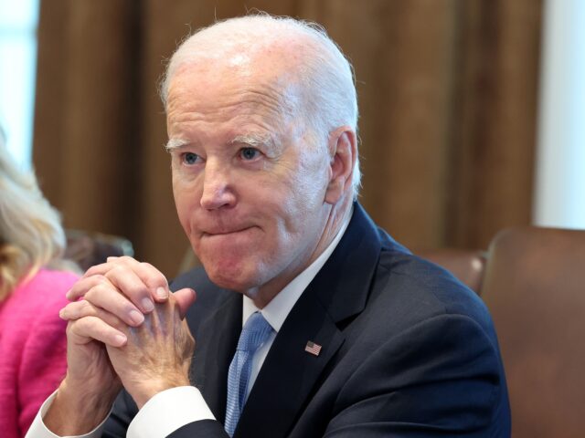 WASHINGTON, DC - SEPTEMBER 13: U.S. President Joe Biden listens to shouted questions regar