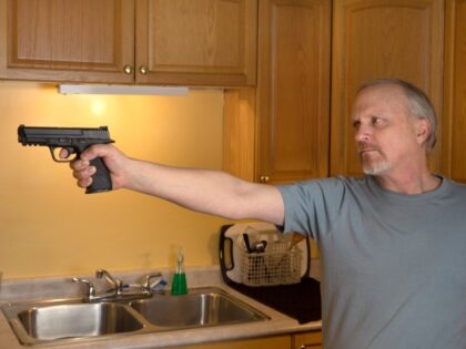 man_gun_kitchen_home intruder_self defense