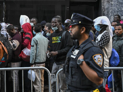 NEW YORK, US - AUGUST 02: Police officers take security measures during migrants line up outside Roosevelt Hotel while waiting for placement inside a shelter as asylum seekers camp outside the hotel after the Manhattan relief center is at full capacity in New York, United States on August 02, 2023. …