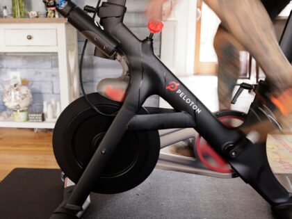 BRICK, NEW JERSEY - APRIL 16: Brody Longo finishes a workout on his Peloton exercise bike on April 16, 2021 in Brick, New Jersey. There is a competitive business war between indoor connected fitness devices fueled by quarantine life due to COVID-19. (Photo by Michael Loccisano/Getty Images)