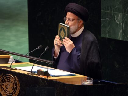 NEW YORK, NEW YORK - SEPTEMBER 19: Iran's President Ebrahim Raisi holds the Koran as he address world leaders during the United Nations (UN) General Assembly on September 19, 2023 in New York City. Israel’s Ambassador to the U.N. Gilad Erdan held up a sign stating 'Iranian Women Deserve Freedom …