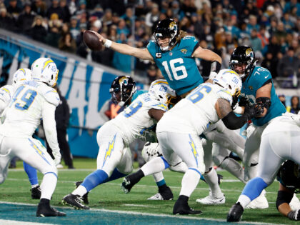 JACKSONVILLE, FLORIDA - JANUARY 14: Trevor Lawrence #16 of the Jacksonville Jaguars dives for a two point con in the AFC Wild Card playoff game at TIAA Bank Field on January 14, 2023 in Jacksonville, Florida. (Photo by Douglas P. DeFelice/Getty Images)