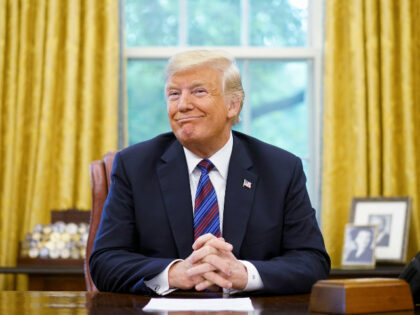 US President Donald Trump smiles during a phone conversation with Mexico's President