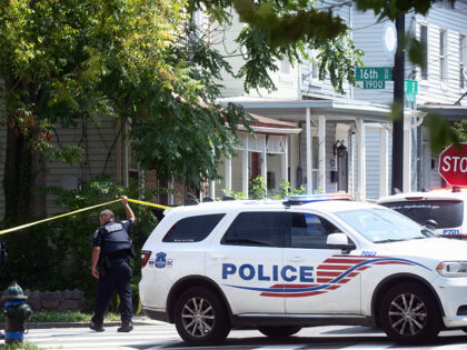 WASHINGTON, DC -AUGUST 06: Police patrol and continue to investigate where three people we