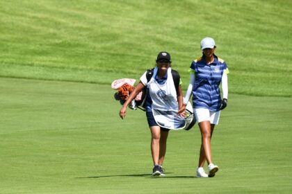 Aditi Ashok with mum Mash carrying her golf bag at the Tokyo Olympics, where she finished fourth