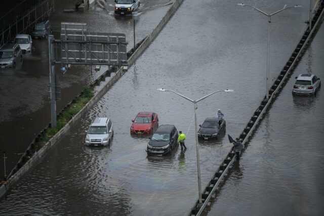 Cars stranded by flooding on New York's FDR Drive