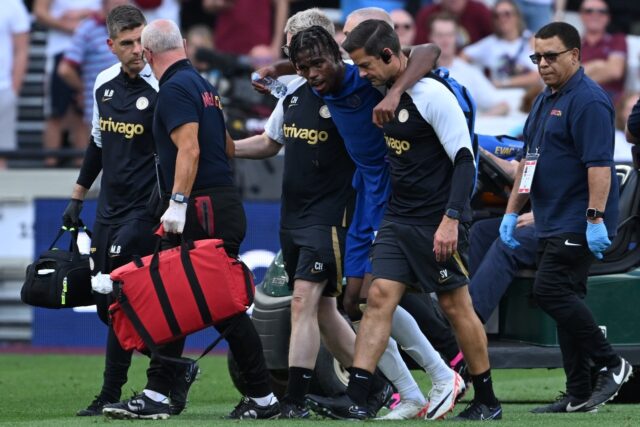 Chelsea midfielder Carney Chukwuemeka walks off the pitch with an injury