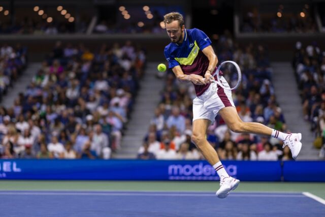 Daniil Medvedev climbs into a backhand in his US Open third round match