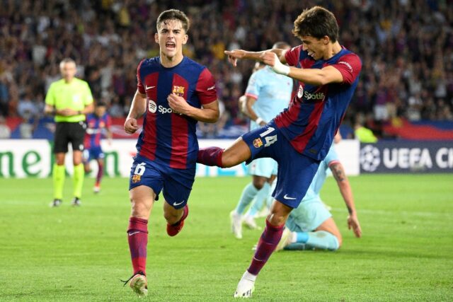 Goalscorers Joao Felix (R) and Gavi (L) celebrate during Barcelona's heavy win over Royal