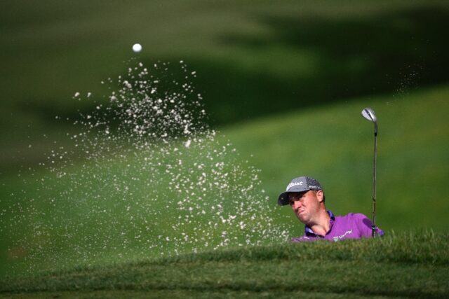 Justin Thomas plays a shot from a bunker prior to the US PGA Tour Fortinet Championship in