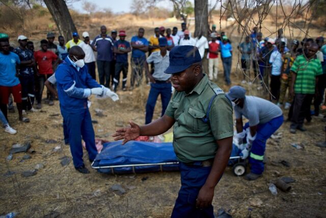 Local residents watched in anguish as rescue workers tried to retrieve bodies from the min