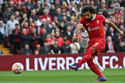 Mohamed Salah scores from a penalty for Liverpool against West Ham United