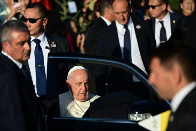 Pope Francis departs the Saints Peter and Paul Cathedral following his meeting with bishop