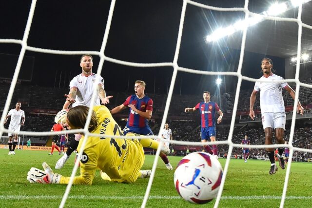 Former Real Madrid great Sergio Ramos (L) scored a painful own goal for Sevilla against Ba