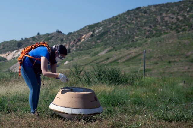 A replica of the Osiris-Rex capsule is seen on June 27, 2023 in Littleton, Colorado; the h