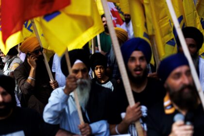 Sikh protesters hold independence flags during a rally outside the Indian consulate in Toronto, after Prime Minister Justin Trudeau said India had a role in the assassination of a Sikh activist in Canada
