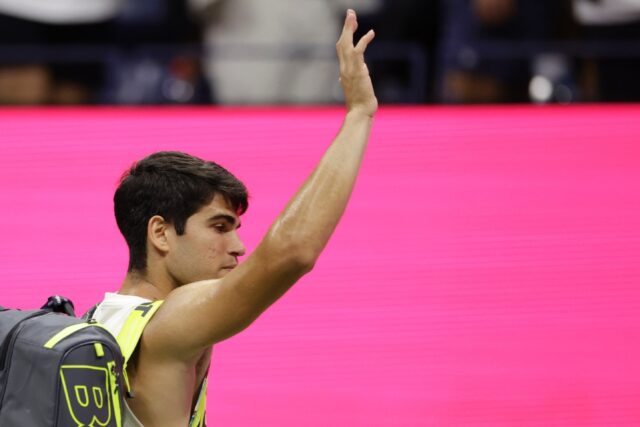 Spain's Carlos Alcaraz waves to fans as he leaves the court after his US Open semi-final l