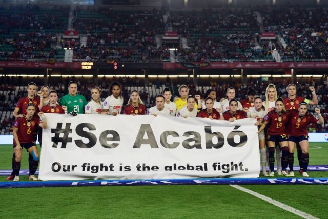 Spain and Switzerland players held up a banner in support of the positive changes La Roja'