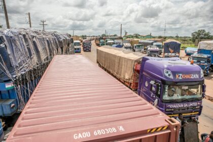 Trucks line up at the closed border crossing between Benin and Niger