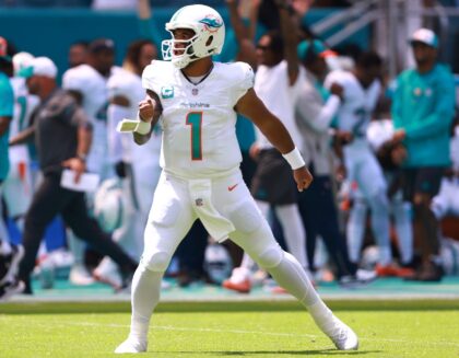 Tua Tagovailoa of the Miami Dolphins reacts after a touchdown during the first quarter of the 70-20 win over the Denver Broncos on Sunday