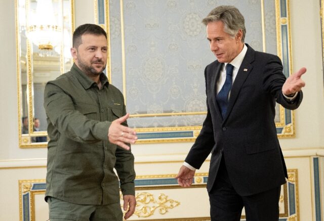 US Secretary of State Antony Blinken (R) introduces members of his delegation to Ukraine's