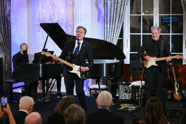 US Secretary of State Antony Blinken performs a Muddy Waters song during a celebration mar