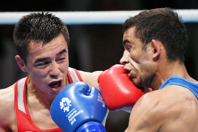 Uzbekistan's Hasanboy Dusmatov (left) was stunned in the 2018 Asian Games flyweight final