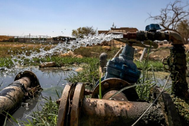 Water flows from irrigation pipes in the Palestinian village of al-Auja in the occupied We