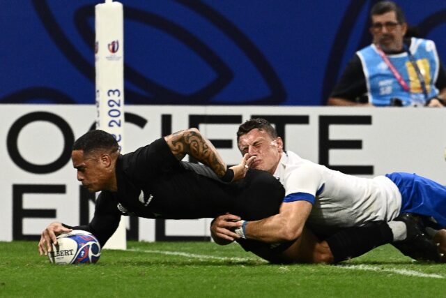 New Zealand scrum-half Aaron Smith scored a hat-trick of tries in the All Blacks' 14-try m