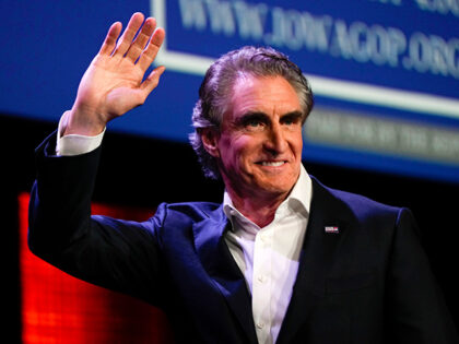 Republican presidential candidate North Dakota Gov. Doug Burgum waves at the Republican Party of Iowa's 2023 Lincoln Dinner in Des Moines, Iowa, Friday, July 28, 2023. (AP Photo/Charlie Neibergall)