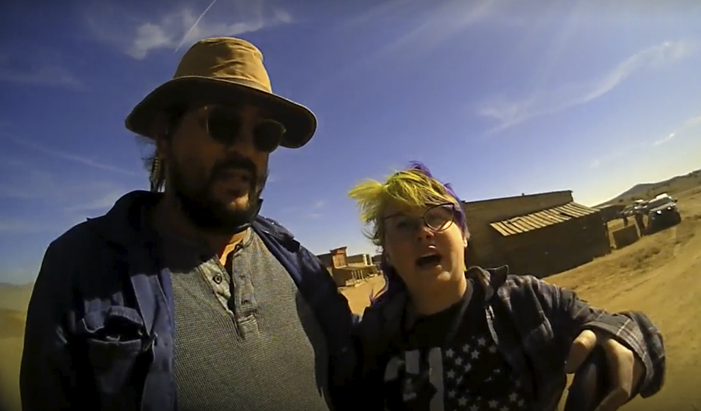 FILE - In this image from video provided by the Santa Fe County Sheriff's Office, movie set armorer Hannah Gutierrez-Reed, right, speaks with a sheriff’s deputy as a colleague stands next to her on the set of the western move “Rust,” shortly after the fatal shooting of cinematographer Halyna Hutchins by Alec Baldwin during a rehearsal, Oct. 21, 2021, in New Mexico. On Friday, Aug. 4, 2023, Gutierrez-Reed agreed to forgo a preliminary hearing that would have provided court testimony from dozens of people, including eyewitnesses to the shooting. (Santa Fe County Sheriff's Office via AP, File)