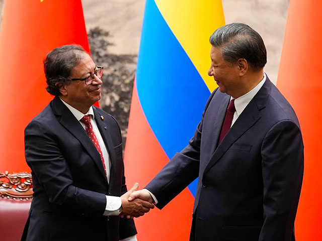 Chinese President Xi Jinping, right, shakes hands with Colombian President Gustavo Petro d