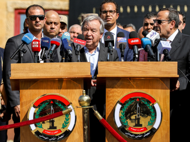United Nations Secretary-General Antonio Guterres (C) speaks outside the gate of the Egyptian side of the Rafah border crossing with the Gaza Strip in the east of North Sinai province on October 20, 2023 during a visit there to oversee preparations for the delivery of humanitarian aid to the war-torn Palestinian enclave. (Photo by Kerolos SALAH / AFP) (Photo by KEROLOS SALAH/AFP via Getty Images)