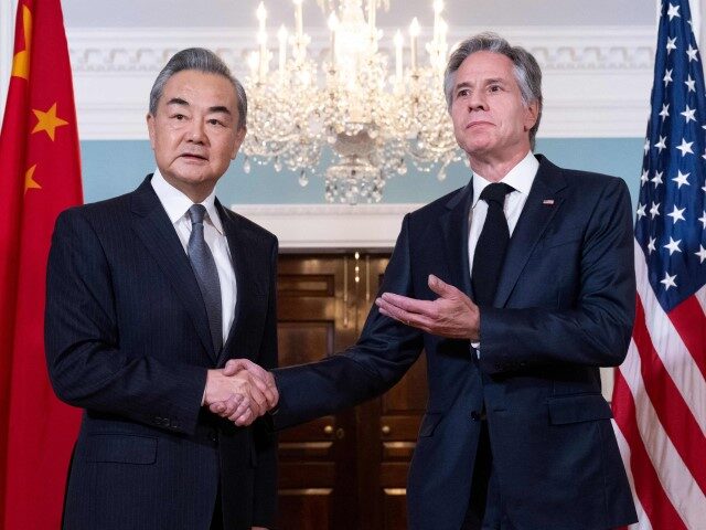U.S. Secretary of State Antony Blinken shakes hands with Chinese Foreign Minister Wang Yi prior to meetings at the State Department in Washington, DC, October 26, 2023. (SAUL LOEB/AFP via Getty)