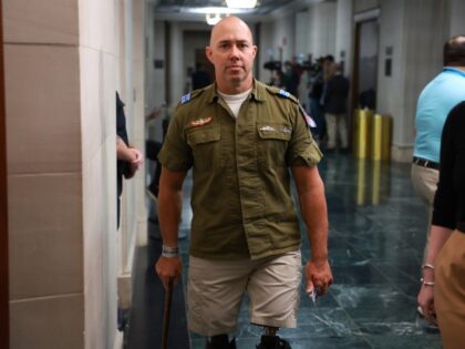 WASHINGTON, DC - OCTOBER 13: U.S. Rep. Brian Mast (R-FL) wears a Israeli Defense Force uniform as he arrives to a House Republican caucus meeting at the Longworth House Office Building on October 13, 2023 in Washington, DC. House Republicans continue to debate their pick for Speaker after their initial …