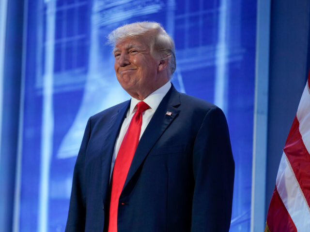 Former President Donald Trump stands on stage during the Moms for Liberty meeting in Phila