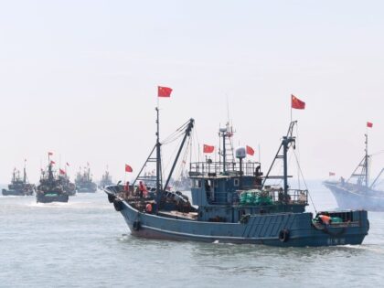 Fleets of fishing boats sail into the deep sea at Jimiya Fishing Port in the West Coast Ne