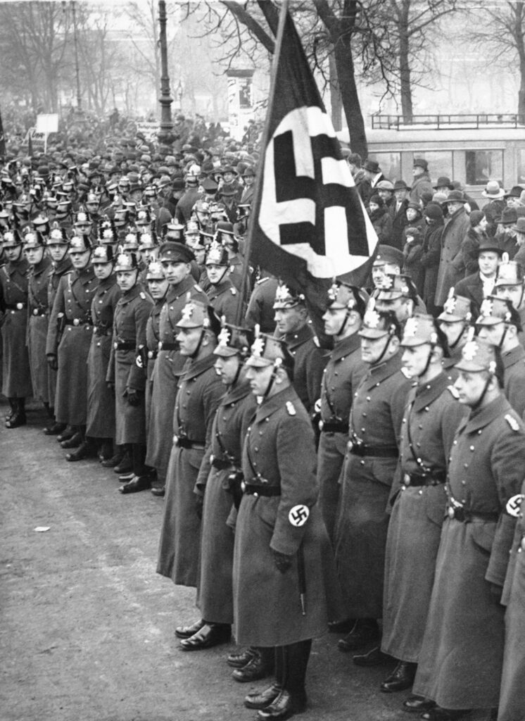 German police stand at attention during a Nazi rally, date unknown. (AP Photo)