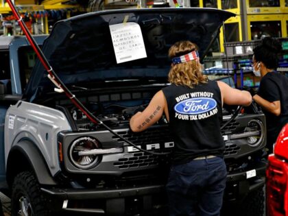 Line workers assemble Ford Motor Company's 2021 Ford Bronco on the line at their Mich