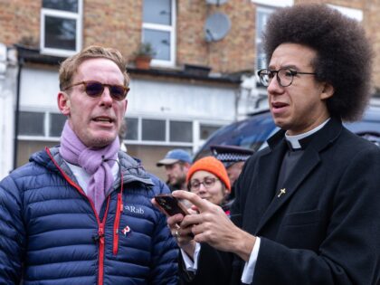 Laurence Fox (l), actor and leader of the Reclaim Party, speaks to Calvin Robinson (r), GB