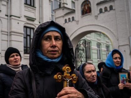 TOPSHOT - Believers of the Ukrainian Orthodox Church, accused of maintaining links with Mo