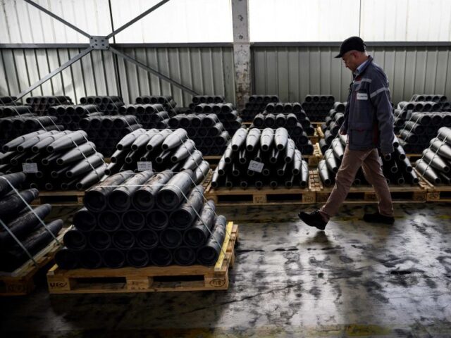 An employee walks at the workshop of the "Forges de Tarbes" which produces 155mm shells, the munition for French Caesar artillery guns in use by the Ukrainian armed forces, in Tarbes, southwestern France, on April 4, 2023. - Nearly two years after financial hardships which saw The Forges de Tarbes …