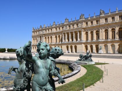 VERSAILLES, FRANCE - JUNE 23: Water basin called Parterre d'eau with the palace of Versail