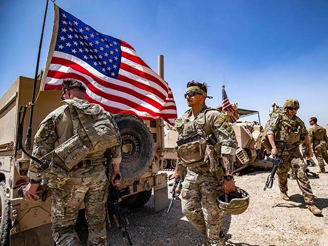 US soldiers patrol the countryside of Rumaylan (Rmeilan) in Syria's northeastern Hasa