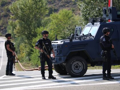 ZVECAN, KOSOVO - SEPTEMBER 30: Kosovo police officers and NATO's Peacekeeping Force in Kos