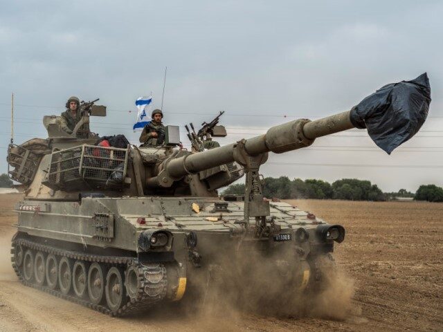 09 November 2023, Israel, Sderot: Israeli soldiers on a tank are seen near the Israel-Gaza border. Fighting between Israeli soldiers and Islamist Hamas militants continues in the border area with Gaza. Photo: Ilia Yefimovich/dpa (Photo by Ilia Yefimovich/picture alliance via Getty Images)