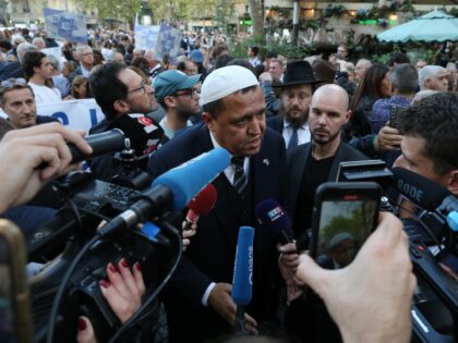 Hassen Chalghoumi (C), the Franco-Tunisian imam of the municipal Drancy mosque in Seine-Saint-Denis, speaks with the press as she attends a rally called for by the Representative Council of French Jewish Institutions (CRIF) in solidarity with Israel after recent Hamas attacks, in Paris on October 9, 2023. (Photo by Michel …