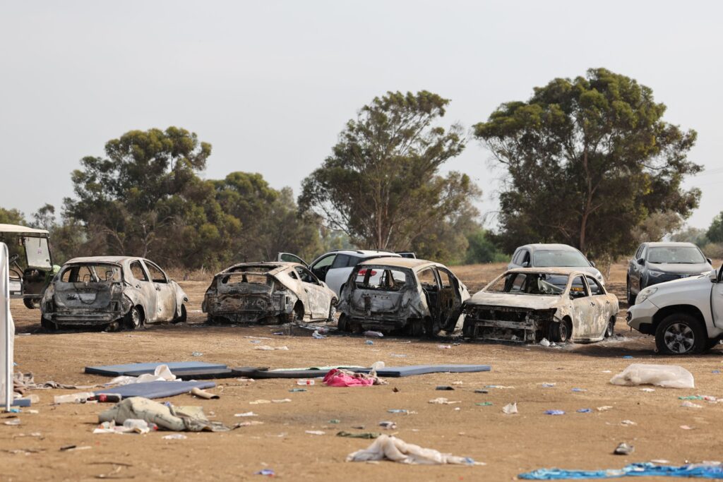 Burnt vehicles are left behind at the site of the weekend attack on the Supernova desert music Festival by Palestinian militants near Kibbutz Reim in the Negev desert in southern Israel on October 10, 2023. Hamas gunmen killed around 270 revellers who were attending an outdoor rave music festival in an Israeli community near Gaza at the weekend, a volunteer who helped collect the bodies said on October 9. (Photo by JACK GUEZ / AFP) (Photo by JACK GUEZ/AFP via Getty Images)